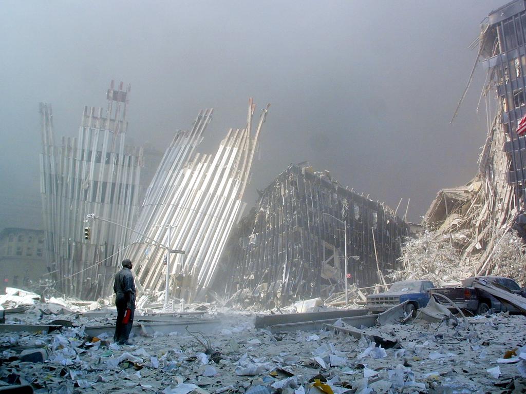 A man stands in the rubble, and calls out asking if anyone needs help, after the collapse of the first World Trade Centre Tower on September 11, 2001. Picture: AFP