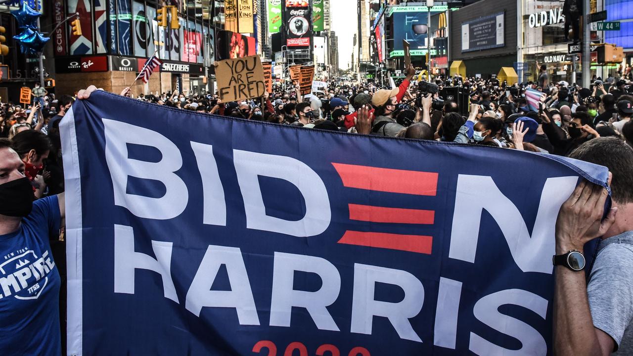 New Yorkers celebrate the Biden win and the end of the volatile Trump presidency. Picture: Stephanie Keith/Getty Images