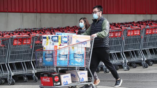 People load up on supplies at Costco, Docklands, on Thursday. Picture: David Crosling