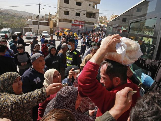 The kingdom of Jordan announced it would deliver bread and water supplies after the government decided to indefinitely extend a curfew amid efforts to contain COVID-19. Picture: AFP