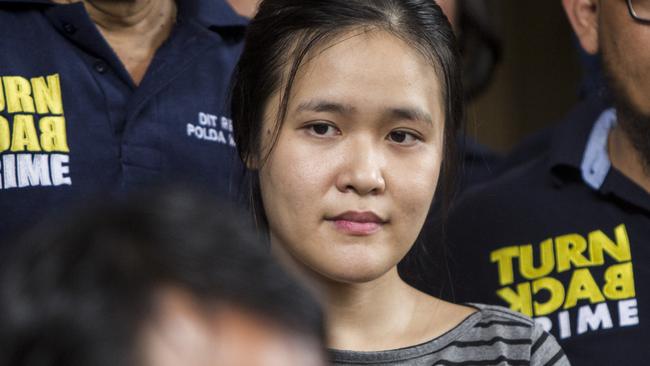 Jessica Kumala Wongso, flanked by police at Pondok Bambu Penitentiary in Jakarta. Picture: AAP