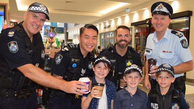 Whitsunday Officer in Charge Senior Sergeant Nathan Blain, back right, with Senior Sergeant Kyle Gould, Sergeant Billy Li, Constable Troy Lawder and Jubilee Pocket's Oliver Steven, 8, Finn Steven, 6, and Oliver-James Crawford, 8, at a ‘Cuppa With A Cop’ event at Whitsunday Plaza.