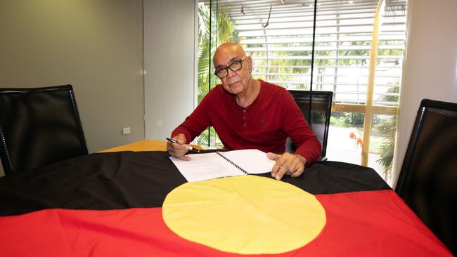 Aboriginal flag artist Harold Thomas signing the copyright over to the Commonwealth government Picture David Hancock