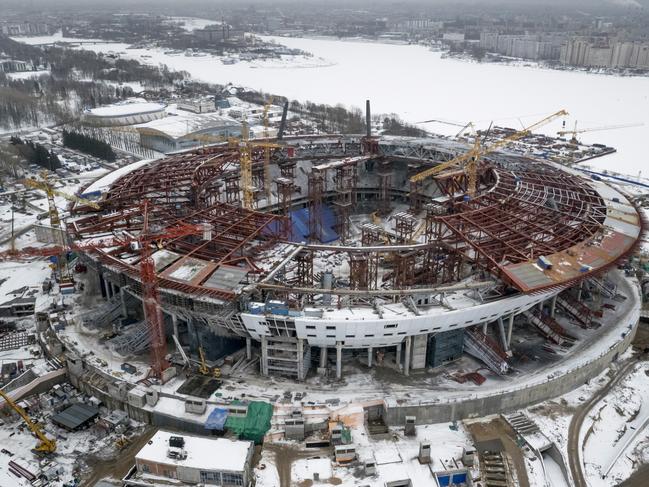 FILE - In this Sunday, Feb. 15, 2015, file aerial view of the the construction site of the new Zenit Stadium which will host matches of the 2018 World Cup in St.Petersburg, Russia. Swiss federal prosecutors opened criminal proceedings related to the awarding of the 2018 and 2022 World Cups, throwing FIFA deeper into crisis only hours after seven soccer officials were arrested and 14 indicted Wednesday in a separate U.S. corruption probe. (AP Photo/Dmitry Lovetsky, file)