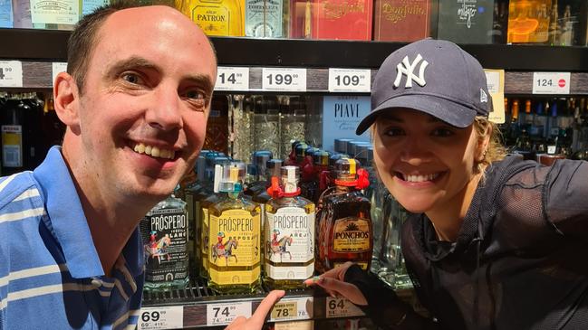 Rita Ora poses with Neil Cairns, store manager at Dan Murphy's in Mosman, March 27, 2021