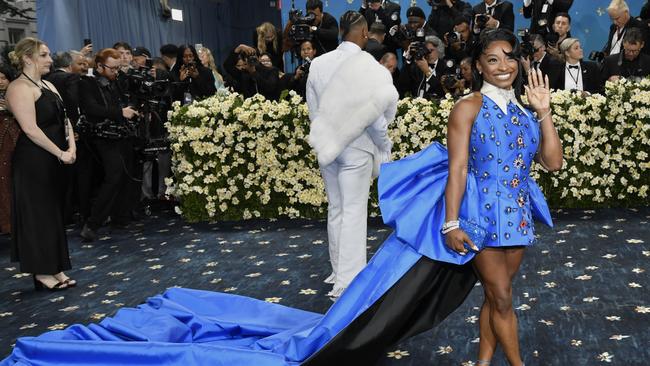 Simone Biles’ blue mini dress certainly stole the spotlight. The GOAT gymnast was seen accompanied by her NFL husband Jonathan Owens. Picture: Getty