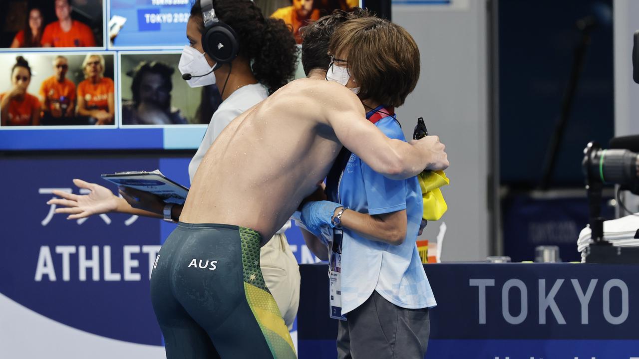 Zac Stubblety-Cook hugs the Japanese official who hands out face masks after a race. Picture: Alex Coppel