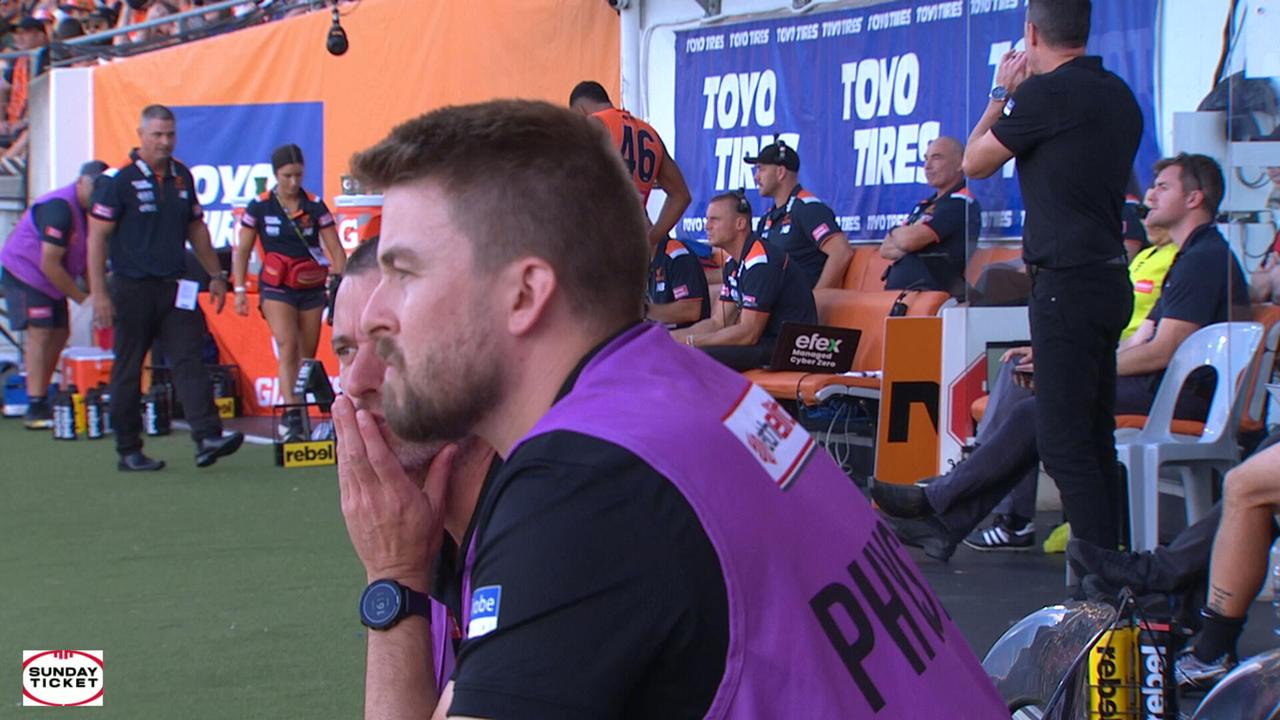 The exchange between rival coaches Adam Kingsley and Craig McRae on the bench.