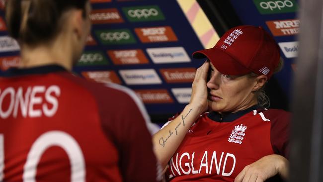 PERTH, AUSTRALIA – FEBRUARY 23: Katherine Brunt of England looks on while talking with Amy Jones after being defeated during the ICC Women's T20 Cricket World Cup match between England and South Africa at the WACA on February 23, 2020 in Perth, Australia. (Photo by Paul Kane/Getty Images)