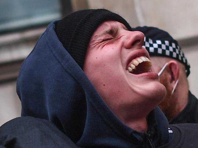 LONDON, ENGLAND - NOVEMBER 28: A man is seen being arrested during a protest on November 28, 2020 in London, England. London is to return to 'Tier 2' or 'high alert' covid-19 restrictions once the current England-wide coronavirus lockdown ends next Wednesday. All three of the tiers, assigned to local authorities across England, have been strengthened since the lockdown began on November 5, however, with the main impacts to be felt by the hospitality sector. (Photo by Peter Summers/Getty Images)