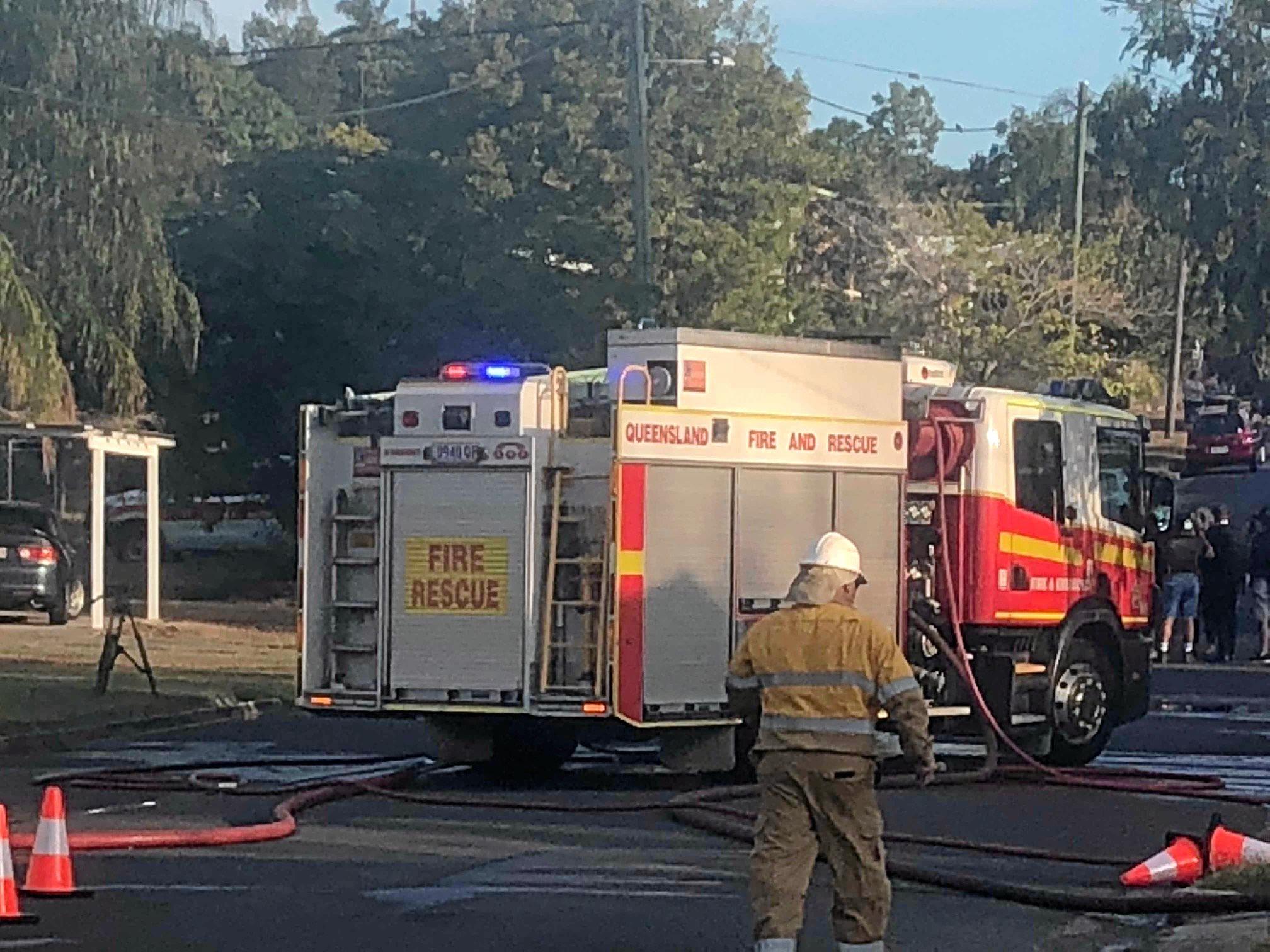 Firefighters at the scene of a house fire on Naughton St, Wandal, this afternoon. Reports indicate the top part of the house is gutted but firefighters are walking in through the front door.