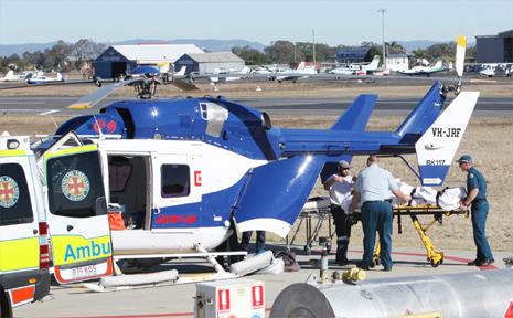 THE RACQ Capricorn Helicopter Rescue Service prepares to airlift a man injured in the fatal crash near St Lawrence yesterday to Rockhampton Hospital. Picture: RACQ Capricorn Helicopter Rescue Service 