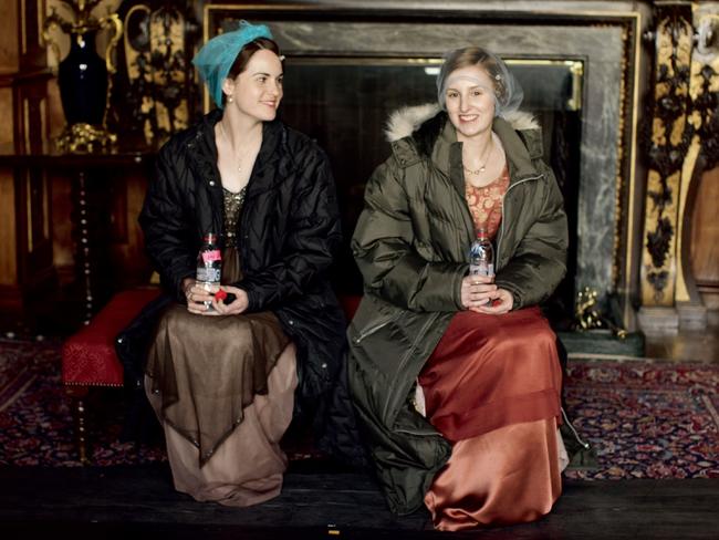 Taking a break ... Michelle Dockery (Lady Mary) and Laura Carmichael (Lady Edith) filming Downton Abbey. Picture: Supplied