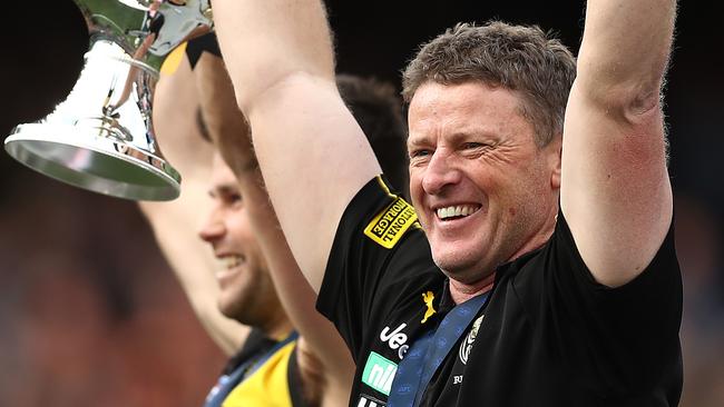 MELBOURNE, AUSTRALIA - SEPTEMBER 28: Tigers captain Trent Cotchin and Tigers head coach Damien Hardwick hold aloft the Premiership Trophy after victory in the 2019 AFL Grand Final match between the Richmond Tigers and the Greater Western Sydney Giants at Melbourne Cricket Ground on September 28, 2019 in Melbourne, Australia. (Photo by Mark Metcalfe/AFL Photos/via Getty Images )