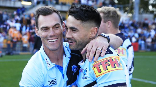 Sharks coach John Morris hugs Shaun Johnson of the Cronulla Sharks after the Round 25 NRL match between the Wests Tigers and the Cronulla Sharks at Leichhardt Oval in Sydney, Sunday, September 8, 2019. (AAP Image/Mark Evans) NO ARCHIVING, EDITORIAL USE ONLY