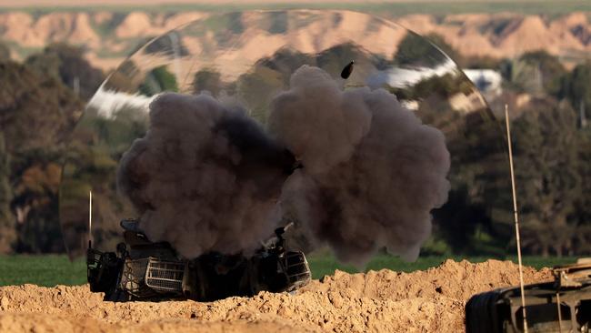 A shock wave is visible as an Israeli self-propelled gun fires a round from southern Israel toward the Gaza Strip on Thursday. Picture: AFP