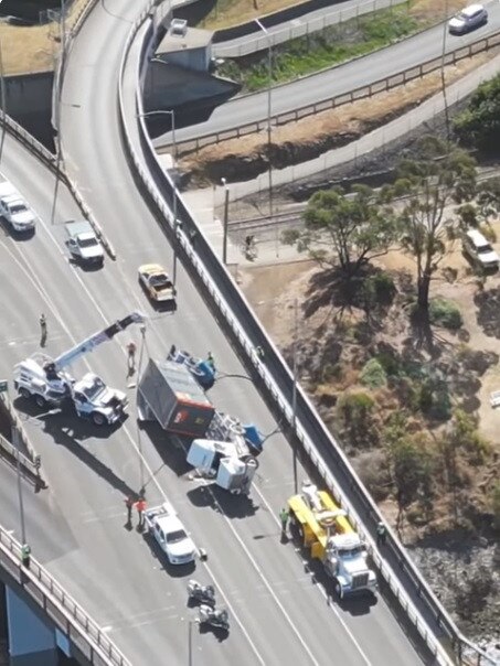 Truck rollover on Tasman Bridge. Video by ‘Mudda Bruddas’