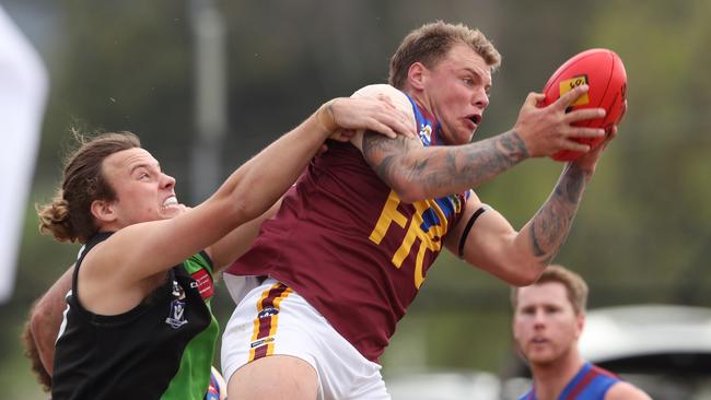 Dermott Yawney marks for Pakenham. Picture: David Crosling