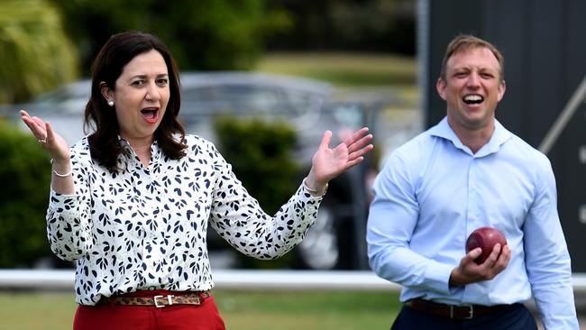 Premier Annastacia Palaszczuk, flanked by her deputy Steven Miles, reacts after bowling during a visit to the Nerang Bowls Club, while on the election campaign trail. Picture: NCA NewsWire / Dan Peled