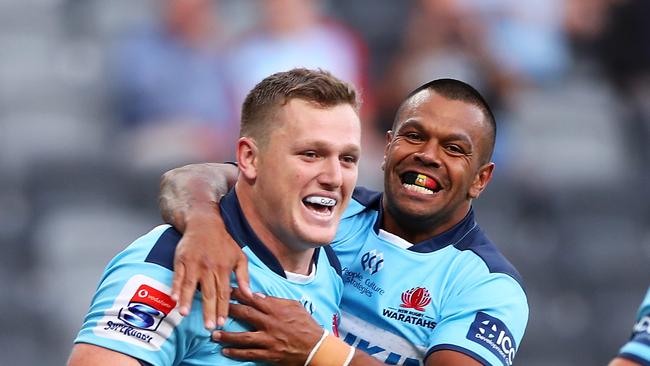 SYDNEY, AUSTRALIA - FEBRUARY 28: Angus Bell and Kurtley Beale of the Waratahs celebrate Bell scoring a try during the round five Super Rugby match between the Waratahs and the Lions at Bankwest Stadium on February 28, 2020 in Sydney, Australia. (Photo by Mark Kolbe/Getty Images)