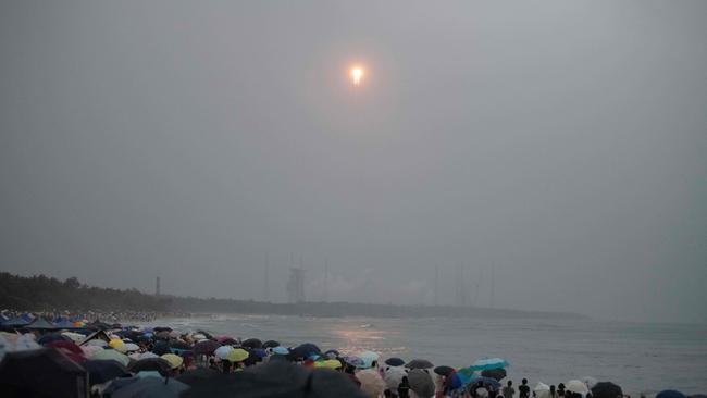 A crowd in China watches Chang’e-6 launch last month. Picture: AFP