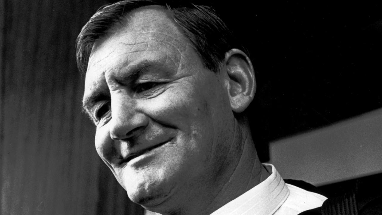 All Blacks coach Brian Lochore arrives at Sydney Airport with his New Zealand team.