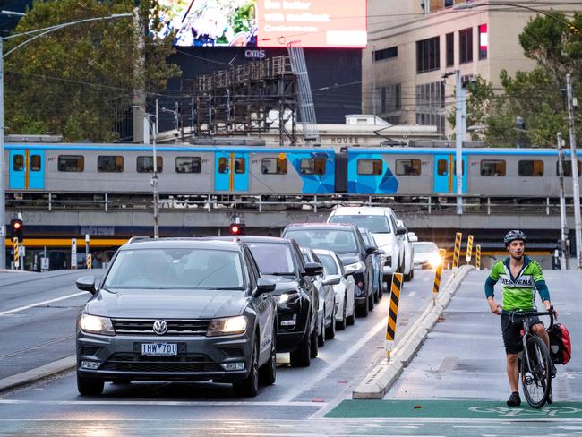 MELBOURNE, MARCH 2, 2022: Cycling lanes are pictured with low usage as compared to car traffic on Queens Bridge St, Melbourne. Picture: Mark Stewart