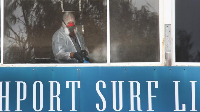 A cleaner at Southport SLSC on Thursday. Picture Glenn Hampson