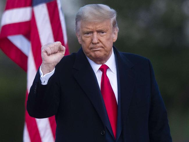 NEWTOWN, PA - OCTOBER 31: President Donald Trump acknowledges supporters after holding a campaign rally on October 31, 2020 in Newtown, Pennsylvania. With the election only three days away, Trump is holding four rallies across Pennsylvania today, as he vies to recapture the Keystone State's vital 20 electoral votes. In 2016, he carried Pennsylvania by only 44,292 votes out of more than 6 million cast, less than a 1 percent differential, becoming the first Republican to claim victory here since 1988.   Mark Makela/Getty Images/AFP == FOR NEWSPAPERS, INTERNET, TELCOS & TELEVISION USE ONLY ==