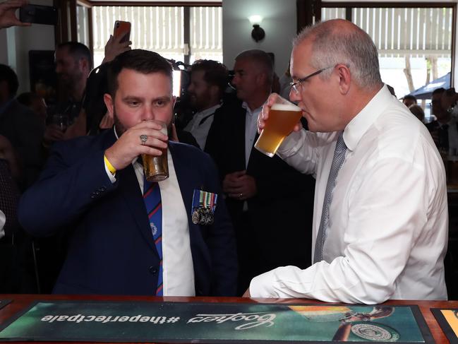 The PM has a beer with LNP candidate Phillip Thompson in Townsville. Picture: Gary Ramage