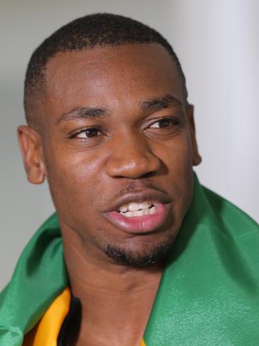 Yohan Blake speaks to the media after arriving at Brisbane International Airport for the Commonwealth Games Picture: Mark Cranitch