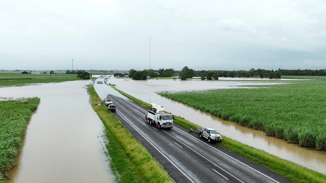 Flood water covers the Bruce Highway at Euramo, south of the Tully River, on Sunday. Picture: Brendan Radke