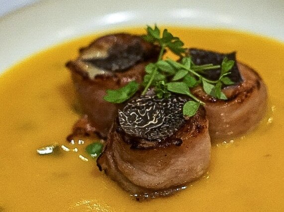 Yu Kitchen’s Hokkaido scallop wrapped in Yunnan ham, truffle and pumpkin velouté.