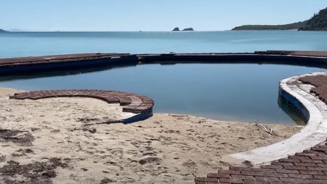 The once-celebrated pool at Brampton Island is now crumbling into the waters of the Great Barrier Reef.