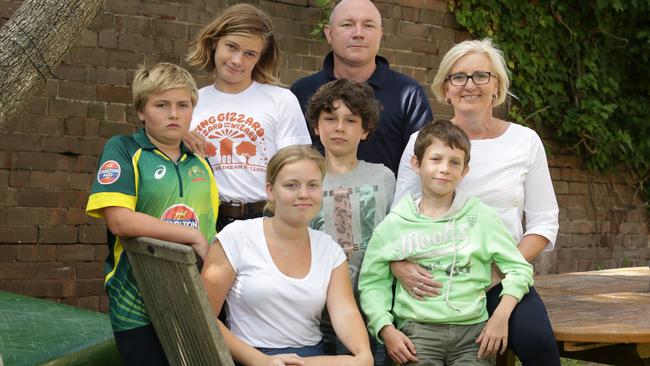 Dieter Winkler and Jacquie Young and their five kids rented a holiday home from Airbnb in Burleigh Heads and one day into their holiday cops raided the property to find a hydroponic cannabis setup in the back room.