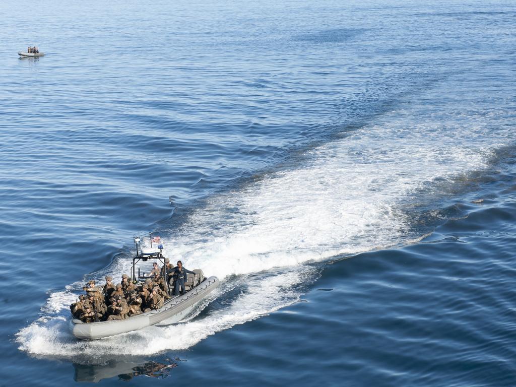 210721-N-XB010-1002 CORAL SEA (July 21, 2021) Sailors attached to USS New Orleans (LPD 18) and Marines assigned to the 31st Marine Expeditionary Unit (MEU) participate in a small boat exercise during Talisman Sabre (TS) 21. This is the ninth iteration of Talisman Sabre, a large-scale, bilateral military exercise between Australia and the U.S. involving more than 17,000 participants from seven nations. The month-long multi-domain exercise consists of a series of training events that reinforce the strong U.S./Australian alliance and demonstrate the U.S. MilitaryÃ¢â&#130;¬â&#132;¢s unwavering commitment to a free and open Indo-Pacific. (U.S. Navy photo by Mass Communication Specialist 2nd Class Desmond Parks)