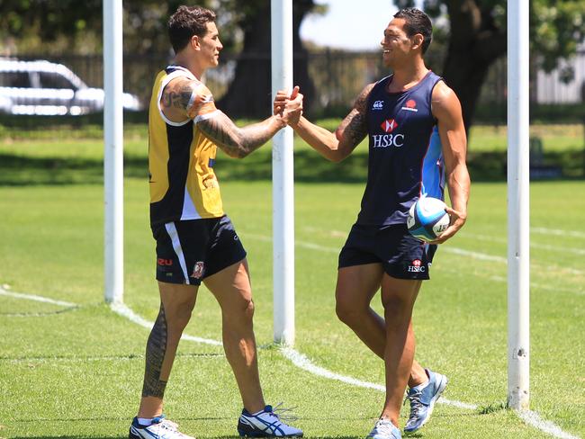 Sonny Bill Williams greets Israel Folau as their training sessions overlapped at Moore Park playing fields. Picture: Supplied