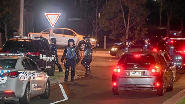 POLICE PRESENCE: Dozens of police, including some in riot gear, gather in Taylors Hill, Melbourne, after a large group of youths wreaked havoc in the area. Picture: Jason Edwards