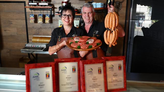 Edge Hill Butchery has won four awards at the Australian Meat Council's Regional Sausage King competition for Far North Queensland. Edge Hill Butchery co owners Julie and Rod Leaver show off some of the sausages, and beef burger patties, that won them the awards.