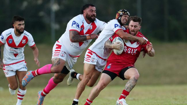 The Woy Woy defence wrapping up Kincumber’s Curtis Naughton. Picture: Sue Graham