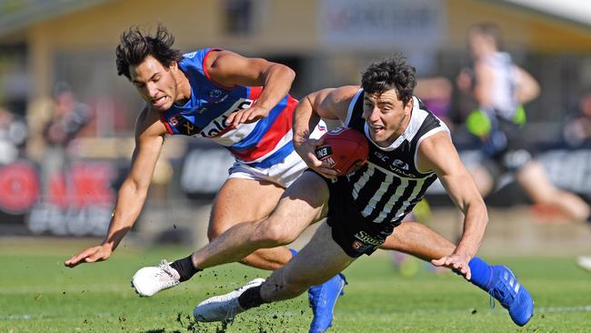 Port's Cameron Hewett evades Central's Troy Menzel. Picture: Tom Huntley