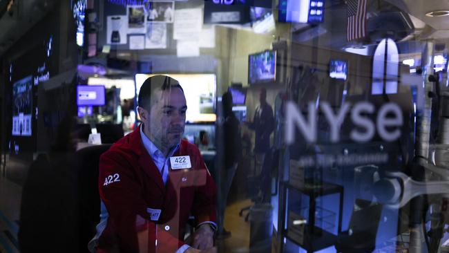 Traders and financial professionals work on the floor of the New York Stock Exchange at the opening bell in New York City. Picture: Charly Triballeau/AFP