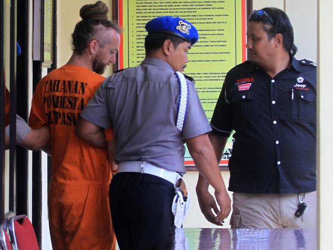 British man David Taylor with police in Bali. Picture: Lukman S. Bintoro