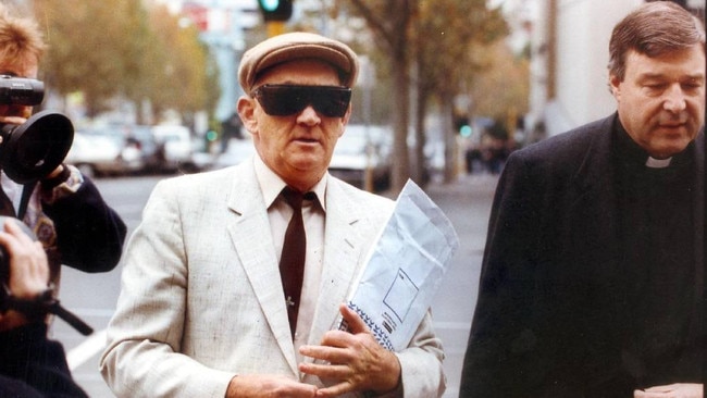 Gerald Ridsdale outside court with George Pell, far right, in 1993.