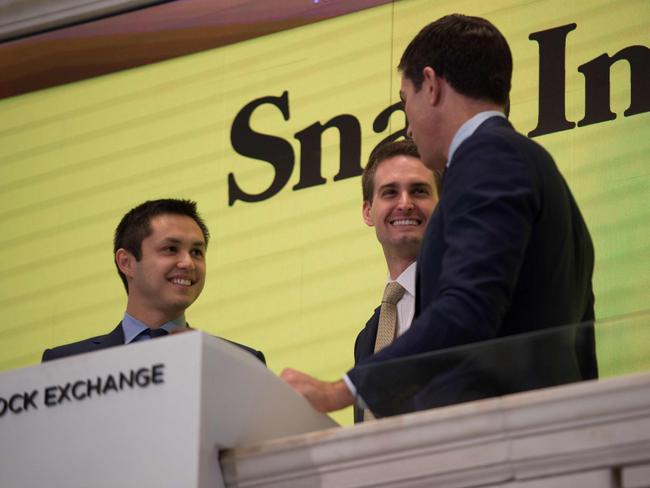 Snap Inc. co-founder Bobby Murphy with CEO Evan Spiegel and NYSE President Thomas Farley, ring the opening bell at the New York Stock Exchange on March 2, 2017 in New York. Picture: AFP