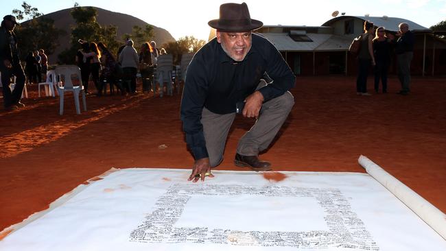 Noel Pearson signs the Uluru Statement in 2017. Picture: James Croucher