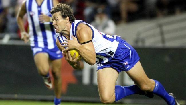 Nathan Thompson taking a mark while playing for the Kangaroos.