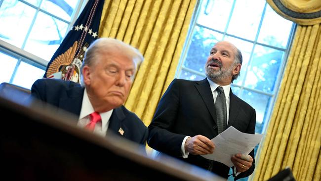 President Trump signing an executive order about tariffs increase, next to Commerce Secretary Howard Lutnick. Picture: Jim Watson/AFP