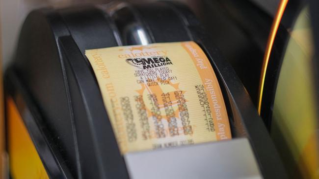 A machine prints a Mega Millions lottery ticket at a 7-Eleven. Picture: Ringo Chiu/AFP