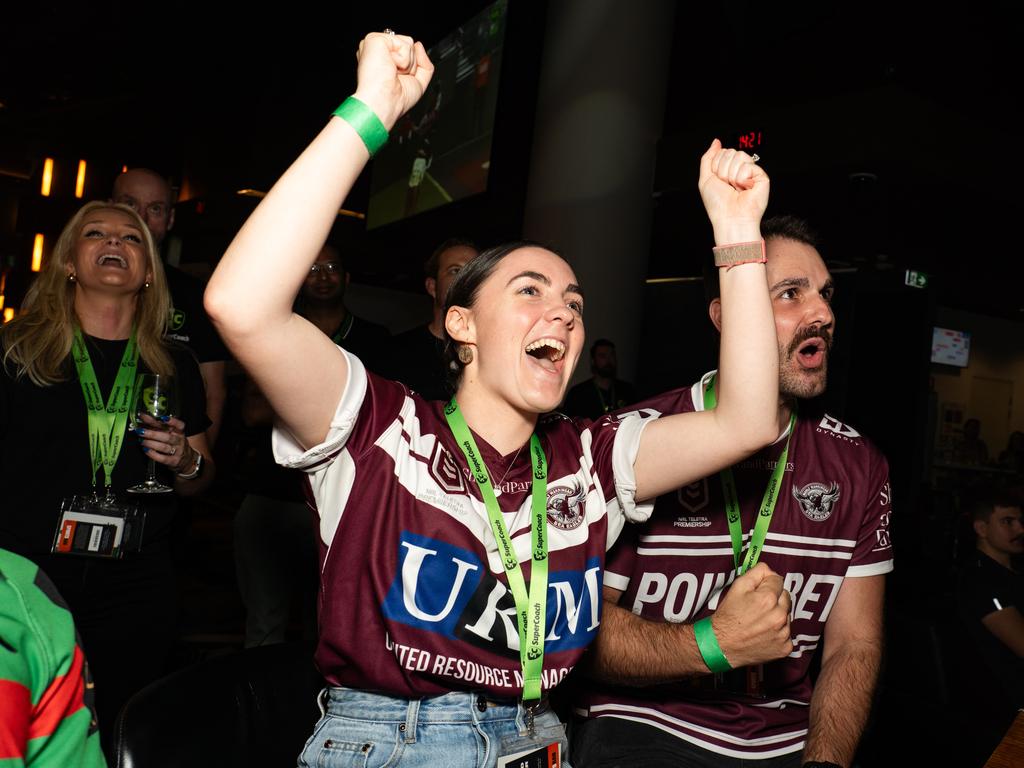 Manly Sea Eagles fans Maddie Tilyard and Liam Lomax celebrate a try at the SuperCoach Viva Non-Vegas Party at the Star Casino in Sydney. Picture: Tom Parrish